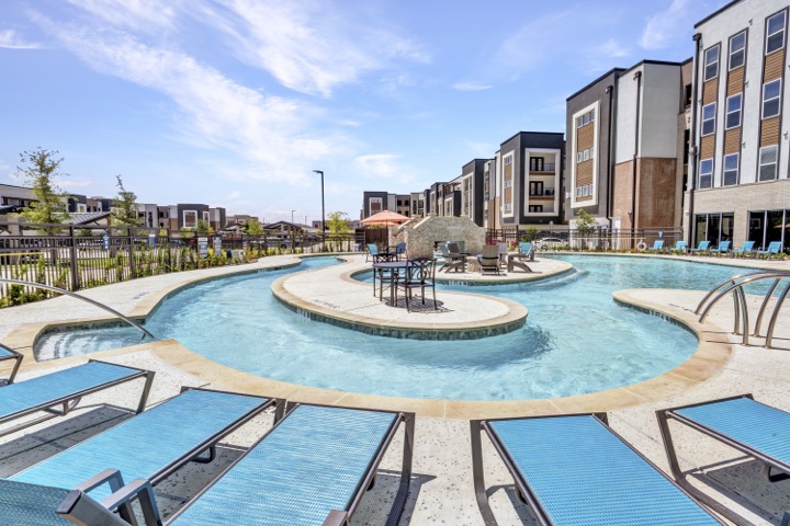 Resort-style pool seating and water feature